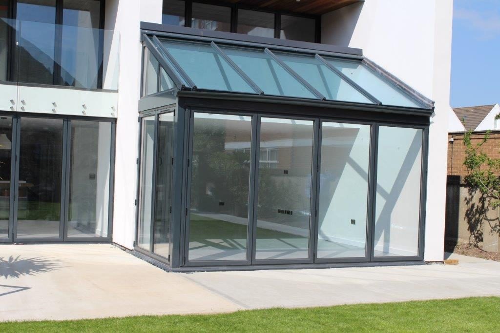 Contemporary kitchen with breakfast bar, high ceiling.