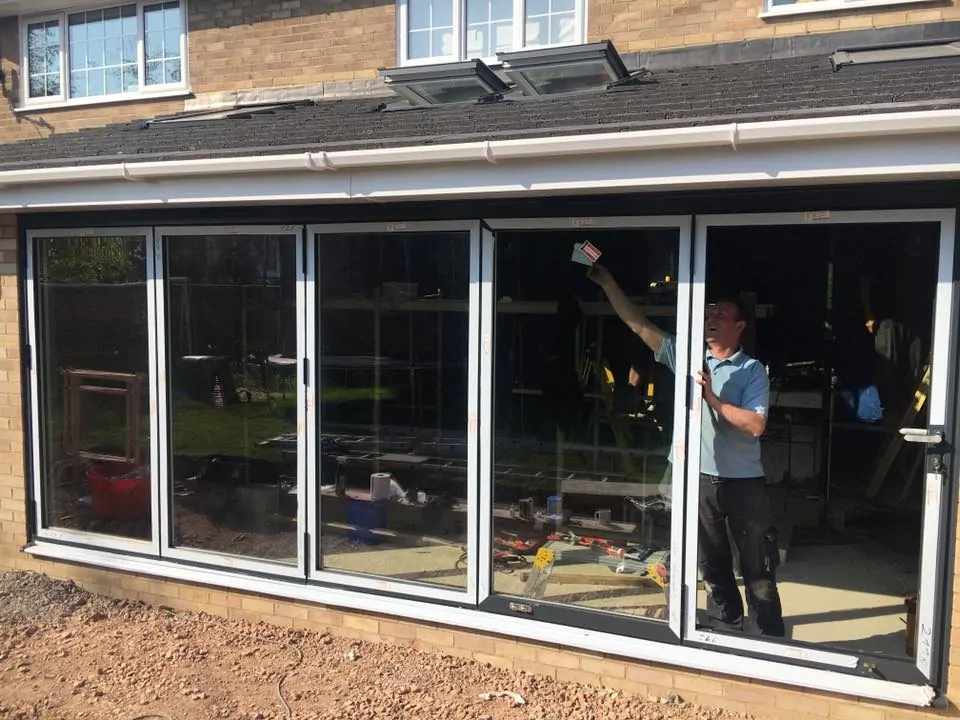 Smart glass patio doors with automated energy-efficient window technology.