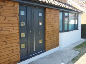 Anthracite grey composite front door in Hove, featuring chrome accents and secure design.
