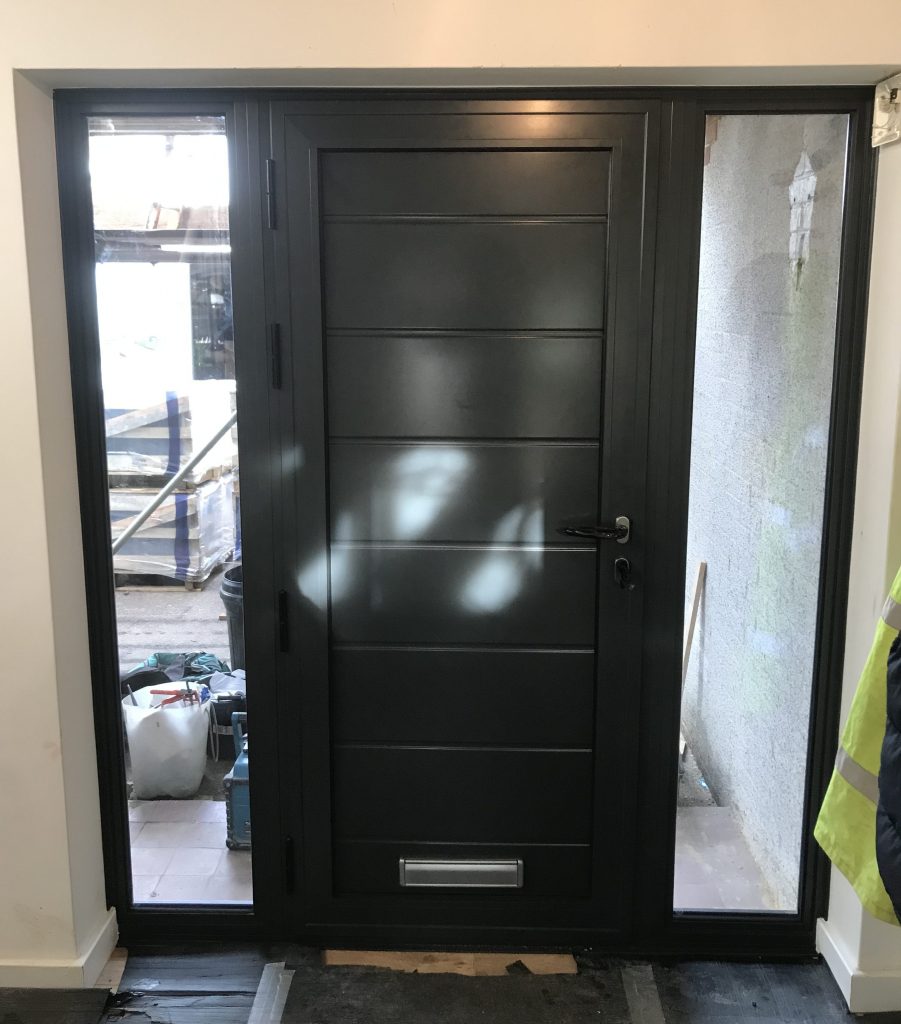 Black front door with glass panels.