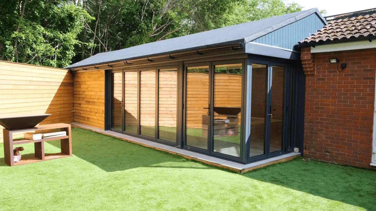 Modern extension with glass sliding doors.