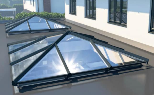 Contemporary two-story home with glass extension.