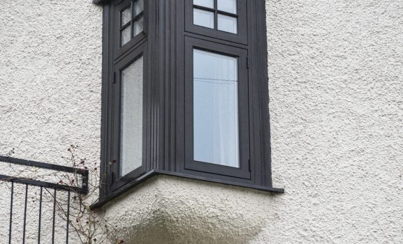 Bay window design on building.