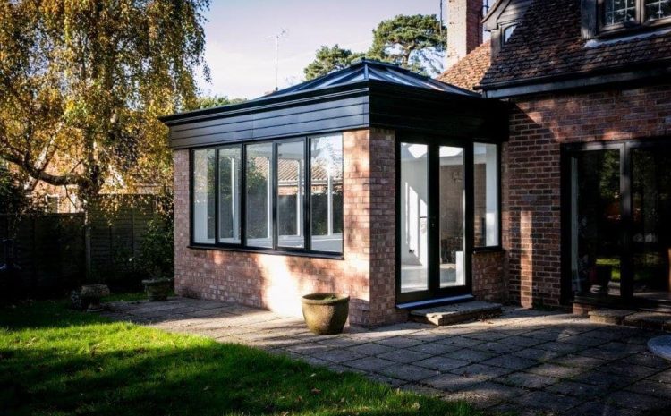 Home extension with black framed windows and white roof lantern