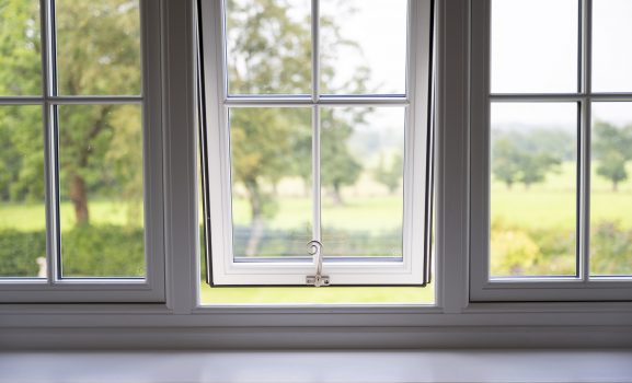 Window view of a green landscape.