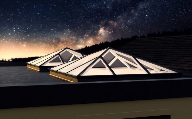 Lantern roof light illuminated at night, enhancing the ambience of a contemporary kitchen
