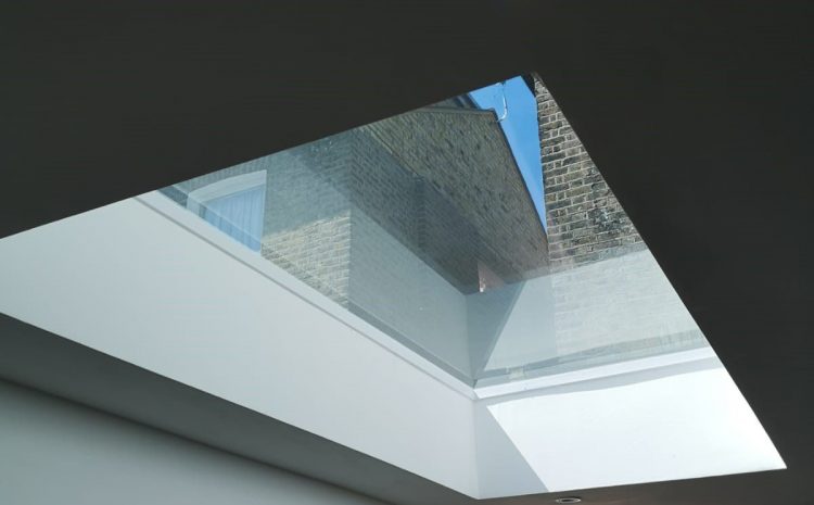 Minimalist interior view of SE4 rooflight flooding modern neutral-toned living space with light.