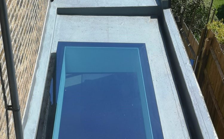 Exterior of SE4 installation showing sleek modern rooflight integrated into flat tiled roof.