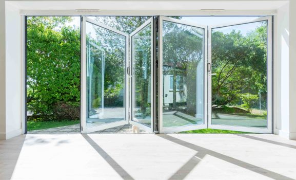 air-aluminium-bifold-doors-everglade-windows-wembley Extensive glass doors, connecting indoor space.