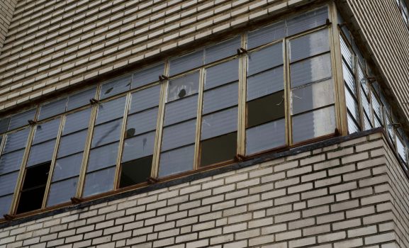 Brick building with multiple windows.