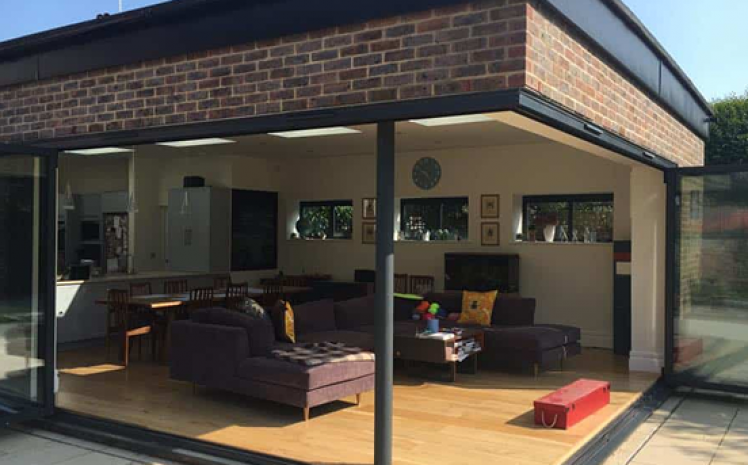 Modern extension with glass sliding doors.