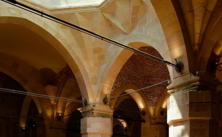 Interior architecture with arched ceilings and skylight.